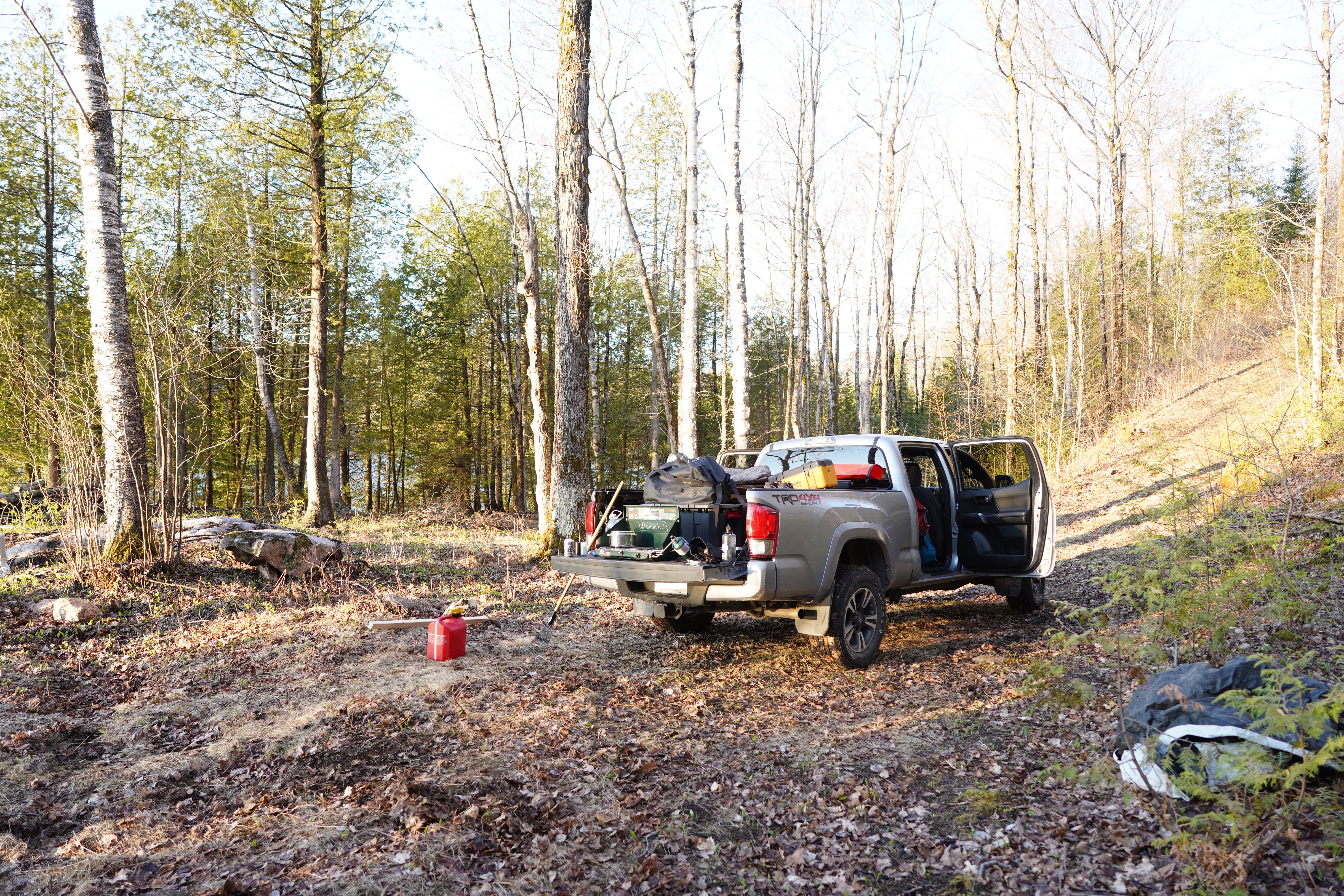 My vehicle, a silver Tacoma pickup, at the lakefront with its bed stuffed full of supplies