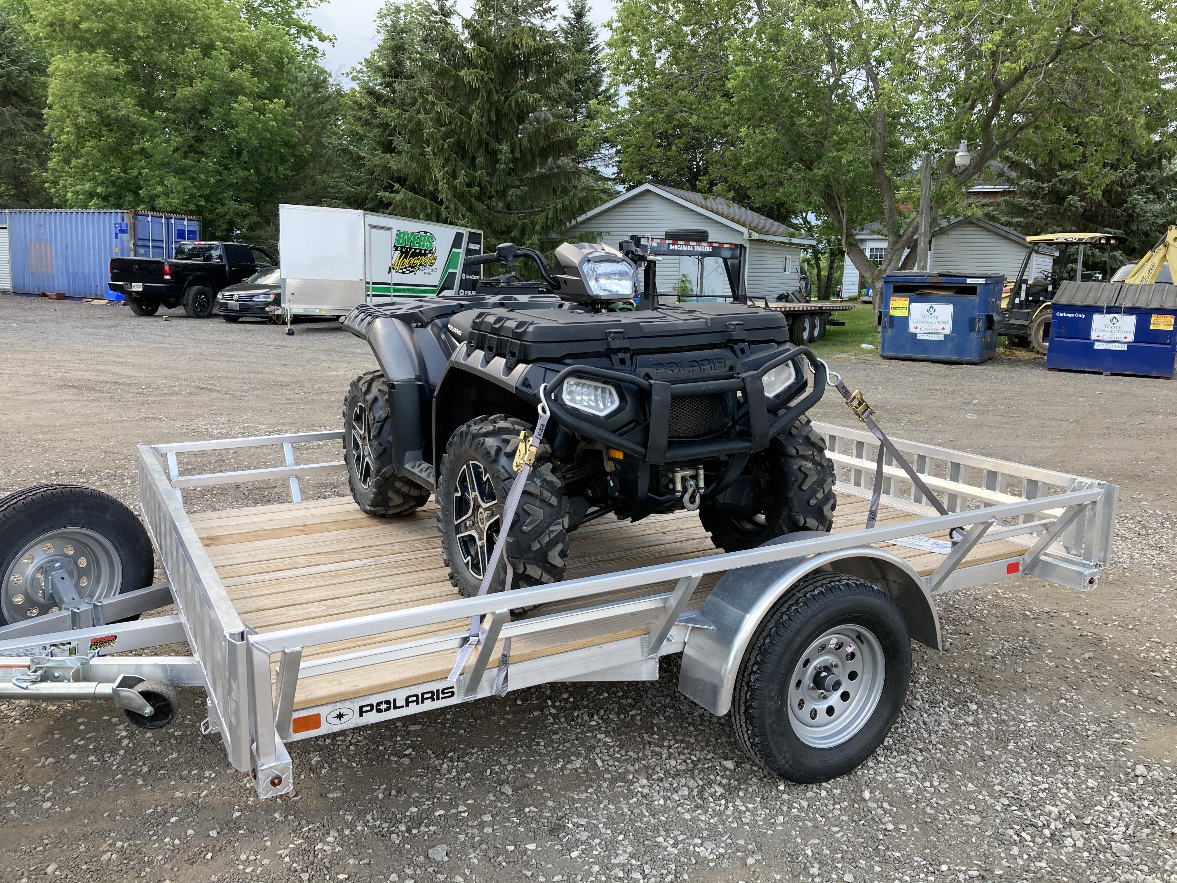The new-to-me ATV loaded on the aluminum trailer. It’s grey.