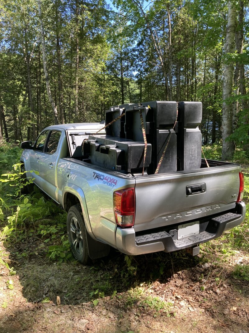 Black rectangular dock floats in the back of my Tacoma