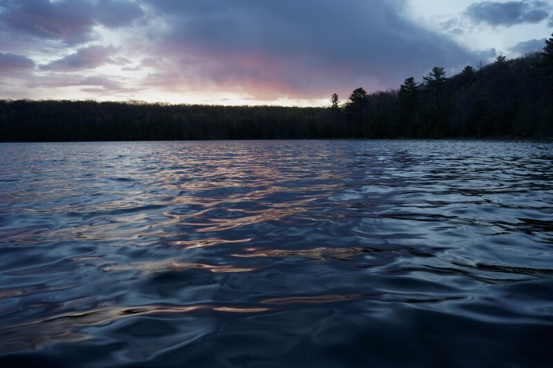 A dusk shot of the ripply surface of the lake