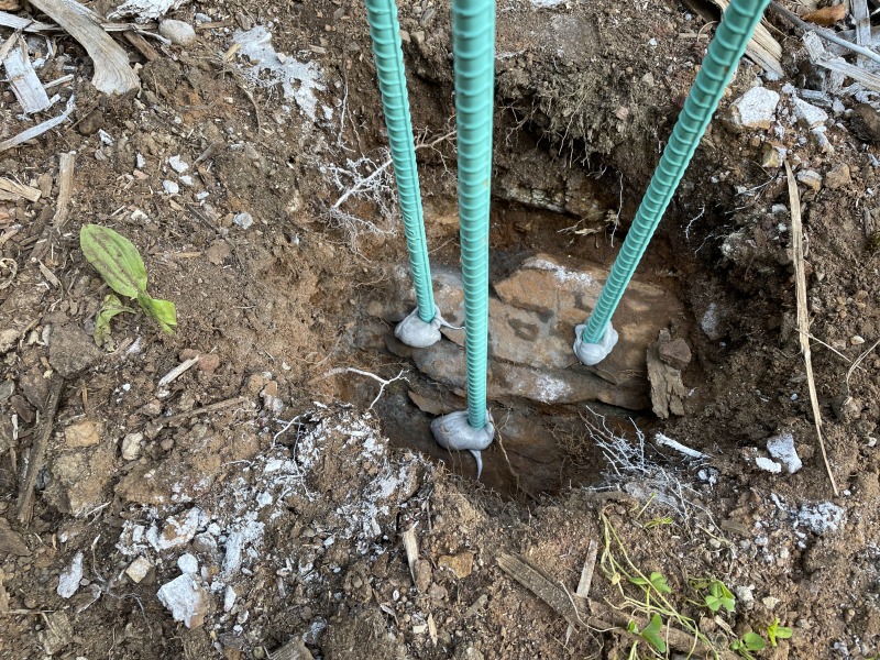 Close up of epoxied rebar in bedrock holes