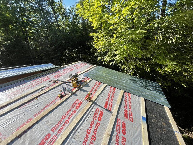 Roofing being laid down. Steel is beginning to go atop the various underlayments.