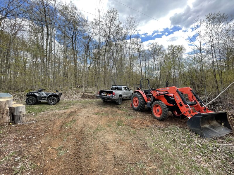 The ATV, Tacoma, and tractor together.