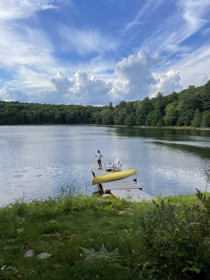 A friend standing on my new dock fishing