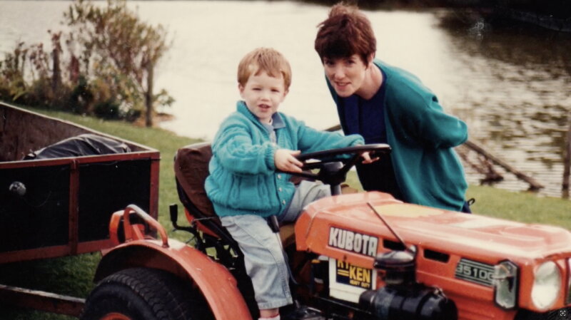 My young self on a small Kubota tractor